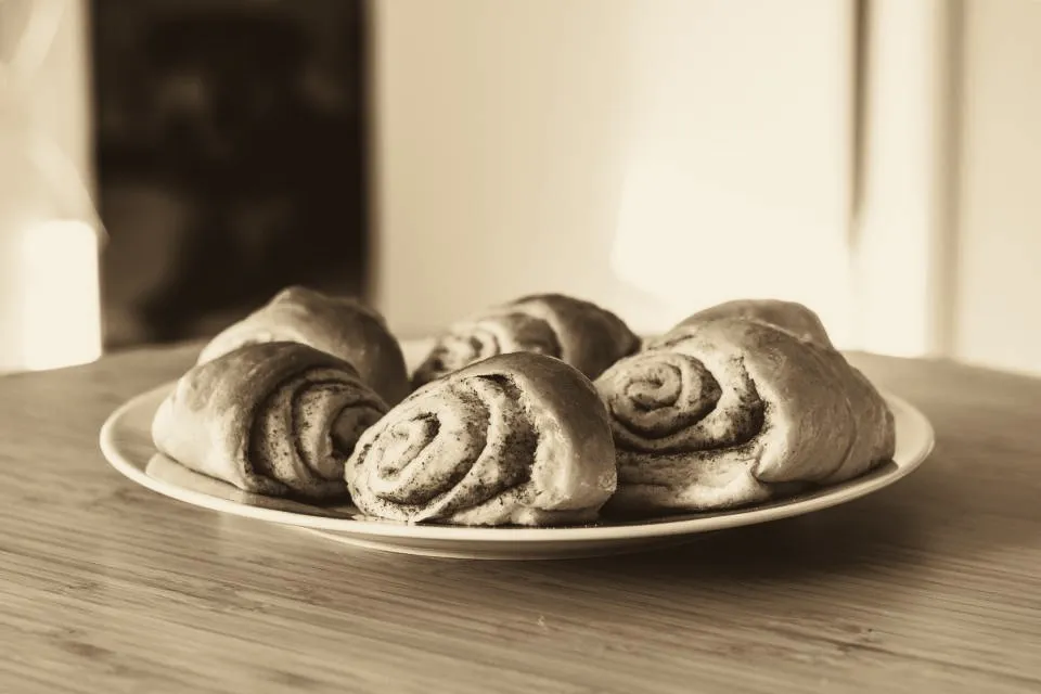 A plate of cinnamon buns on a table